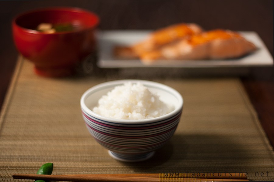 traditional Japanese meal with a bowl of plain rice